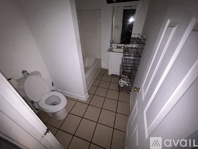 A bathroom with a toilet and a sink.