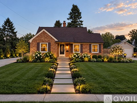 A house with a well-manicured lawn and a pathway leading to the front door.