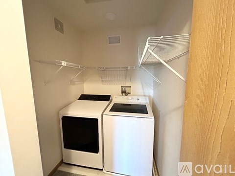 A small kitchen with a microwave and oven.