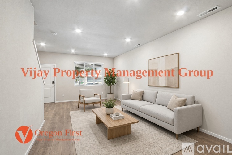 A living room with a couch, chair, and coffee table, with the text "Vijay Property Management Group" and "Oregon First" overlaid.