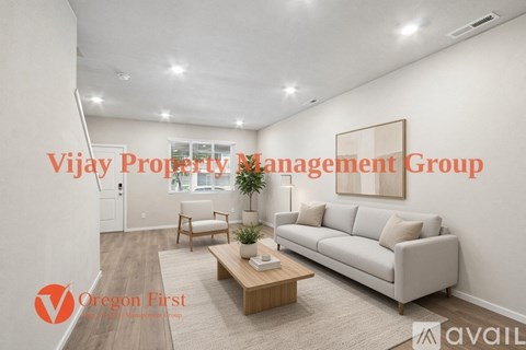 A living room with a couch, chair, and coffee table, with the text "Vijay Property Management Group" and "Oregon First" overlaid.
