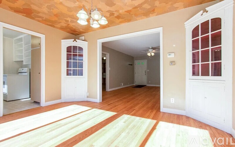 A room with a striped rug on the floor.
