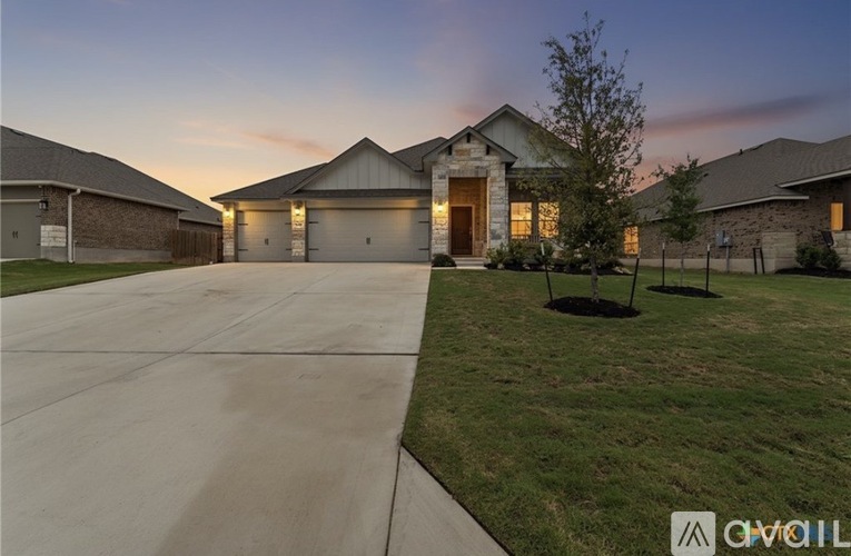 A house with a driveway in front of it.