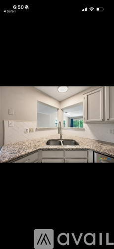 A kitchen with a sink and cabinets.