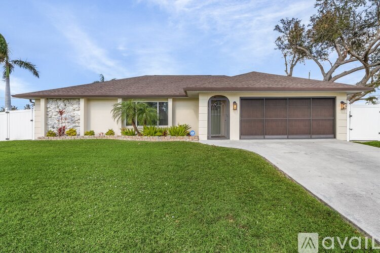 A house with a brown roof and a white garage door.