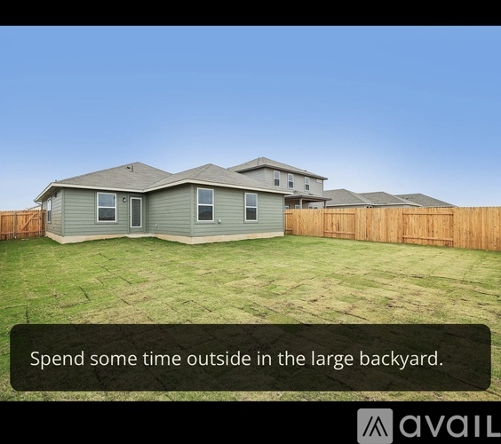 A house with a large backyard is available for rent.