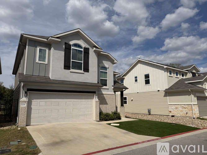 A house with a garage is for sale.