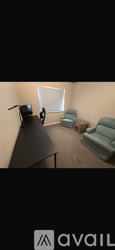 A room with a black table and a television on it.