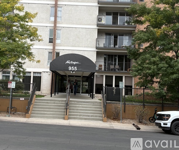 The entrance to a building with the number 955 on it.