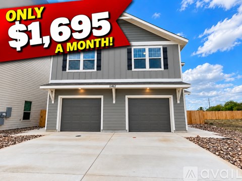 A house with a sign that says "ONLY $1,695 A MONTH!" is for sale.