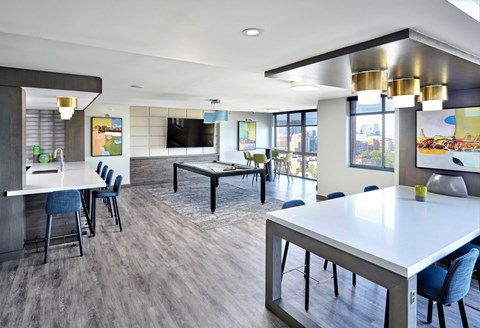 A modern kitchen with a dining table and chairs.