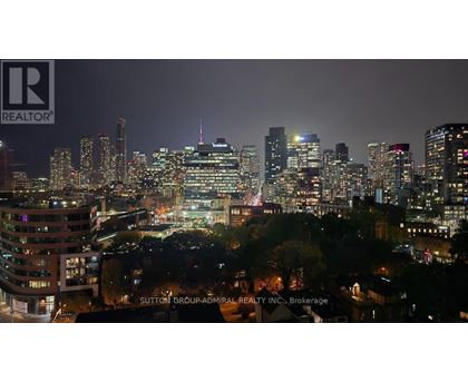 A cityscape at night with the Sutton Group-Admiral Realty Inc. logo in the bottom right corner.