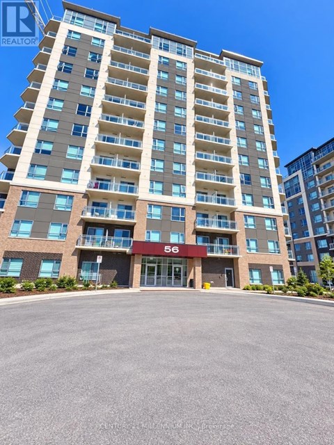 A tall residential building with the number 56 on the front.