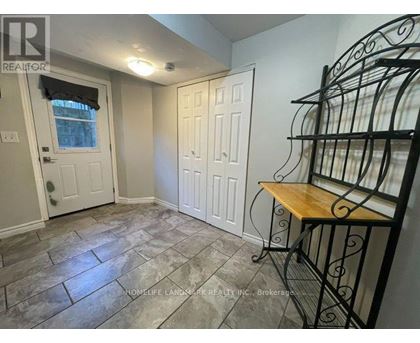 A room with a table and chairs in it.
