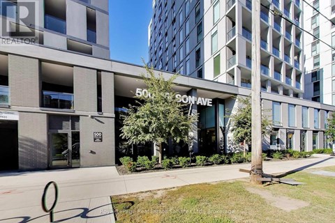 A modern building with the name "SON AVE" on the front.