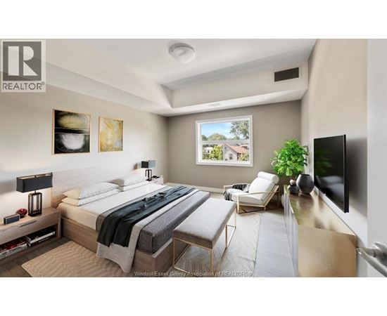 A bedroom with a large bed and a flat screen TV mounted on the wall.