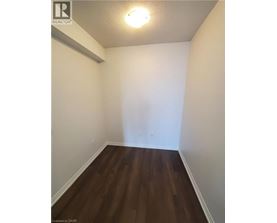 A room with wooden floors and white walls.