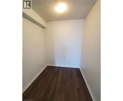 A room with wooden floors and white walls.