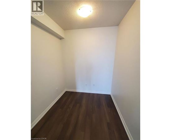 A room with wooden floors and white walls.