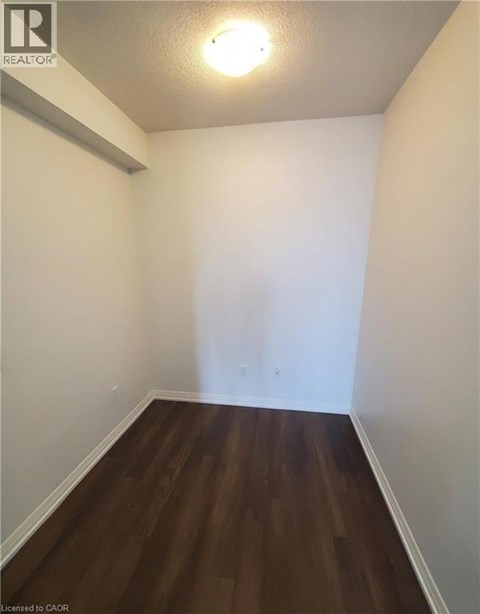 A room with wooden floors and white walls.