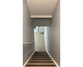 A long flight of stairs leading to a door.