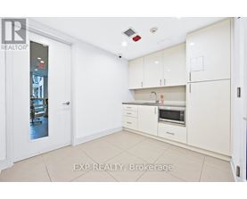 A white kitchen with EXP REALTY, Brokerage watermark.