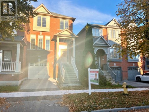 A real estate sign in front of a house.