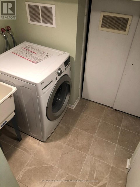 A white washer and dryer in a laundry room.