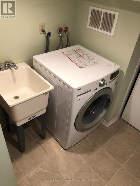 A white washer and dryer in a small laundry room.
