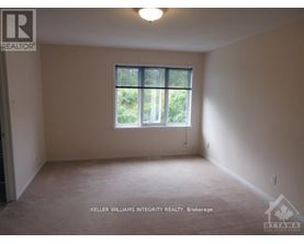 A room with a window and a sign that says "REALTOR".