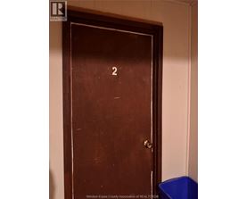 A brown door with a number 2 on it.