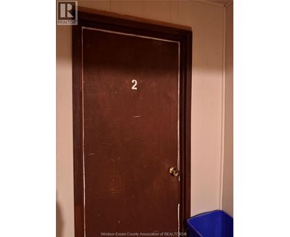 A brown door with a number 2 on it.