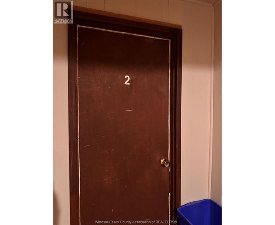 A brown door with a number 2 on it.