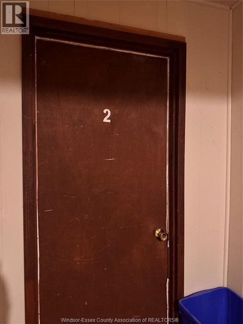 A brown door with a number 2 on it.