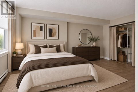 A well-lit bedroom with a large bed and a wooden dresser.