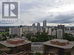 A cityscape with a Realty logo in the corner.