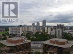 A cityscape with a Realty logo in the corner.