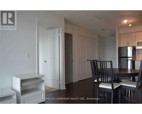 A dining area with a table and chairs.