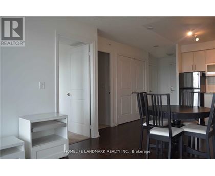A dining area with a table and chairs.