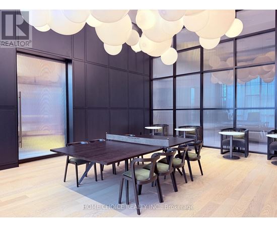 A dining room with a long table and chairs.