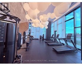 A gym with treadmills, elliptical machines, and a rowing machine.