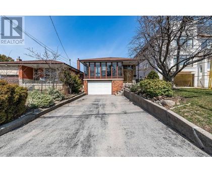A house with a driveway in front of it.