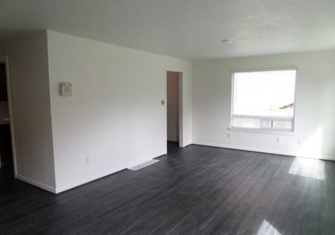 A room with a window and a door.