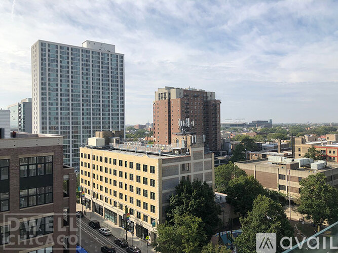A cityscape with buildings and a clear sky.