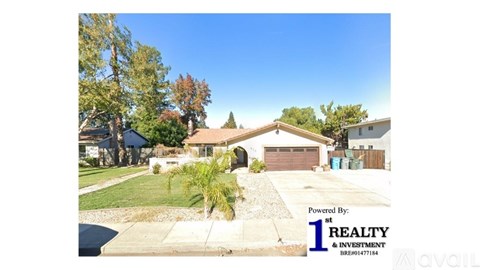 A real estate advertisement showing a suburban house with a clear blue sky.