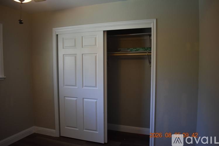 A white door is open to a pantry.