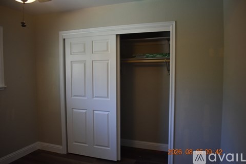 A white door is open to a pantry.
