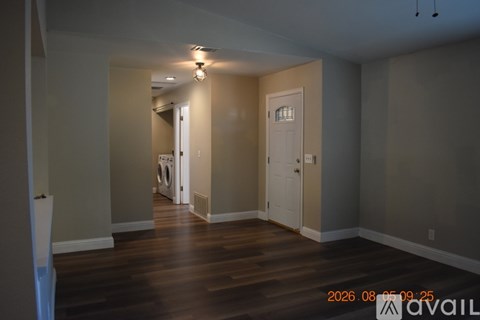 A room with a washer and dryer in it.
