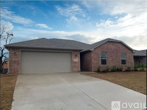 A house with a garage door that says "available" on it.