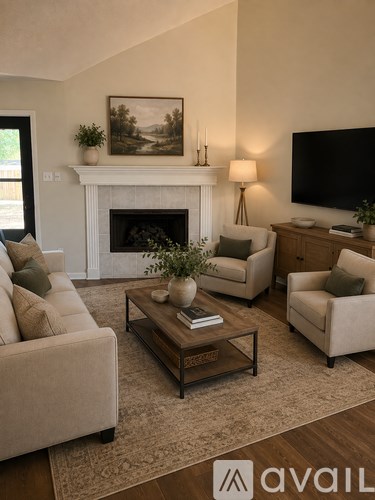 A living room with a fireplace, two chairs, a couch, and a coffee table.
